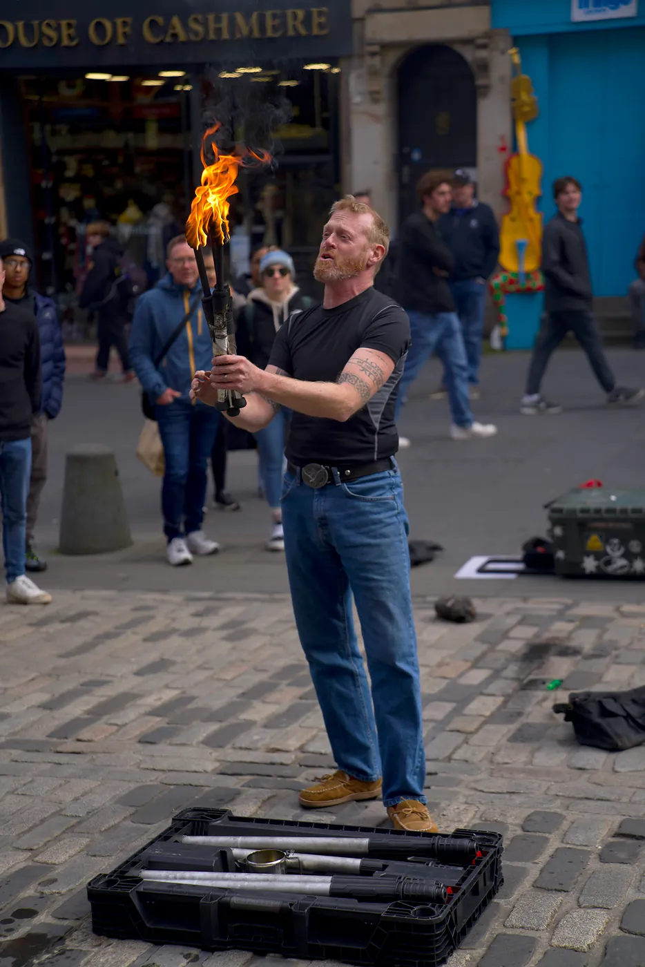 A street performer playing with fire.