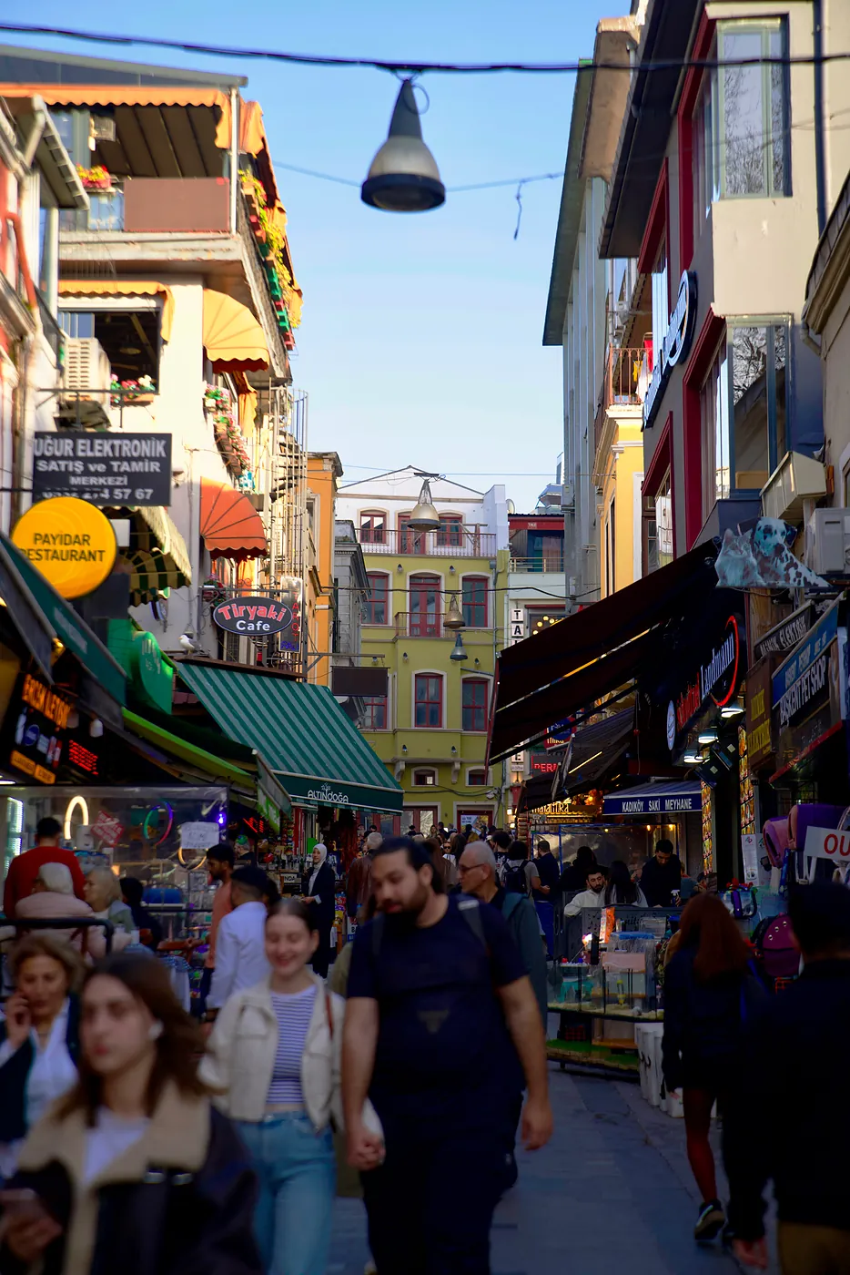 A side street clad with restaurants.