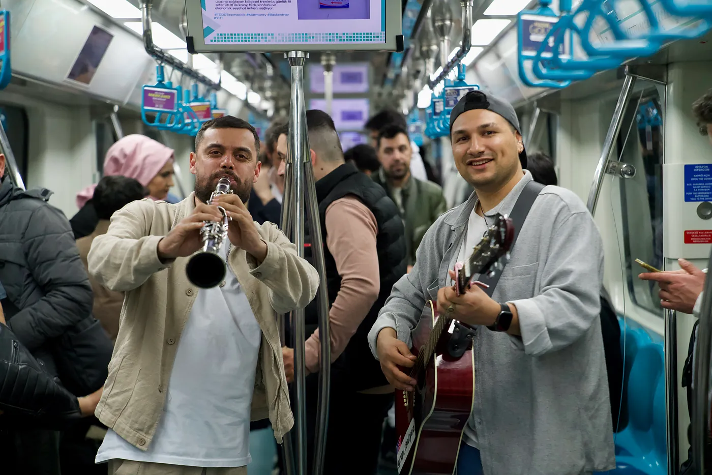 A group of musicians playing on the Marmaray, the longest line of Istanbul's Metro system.